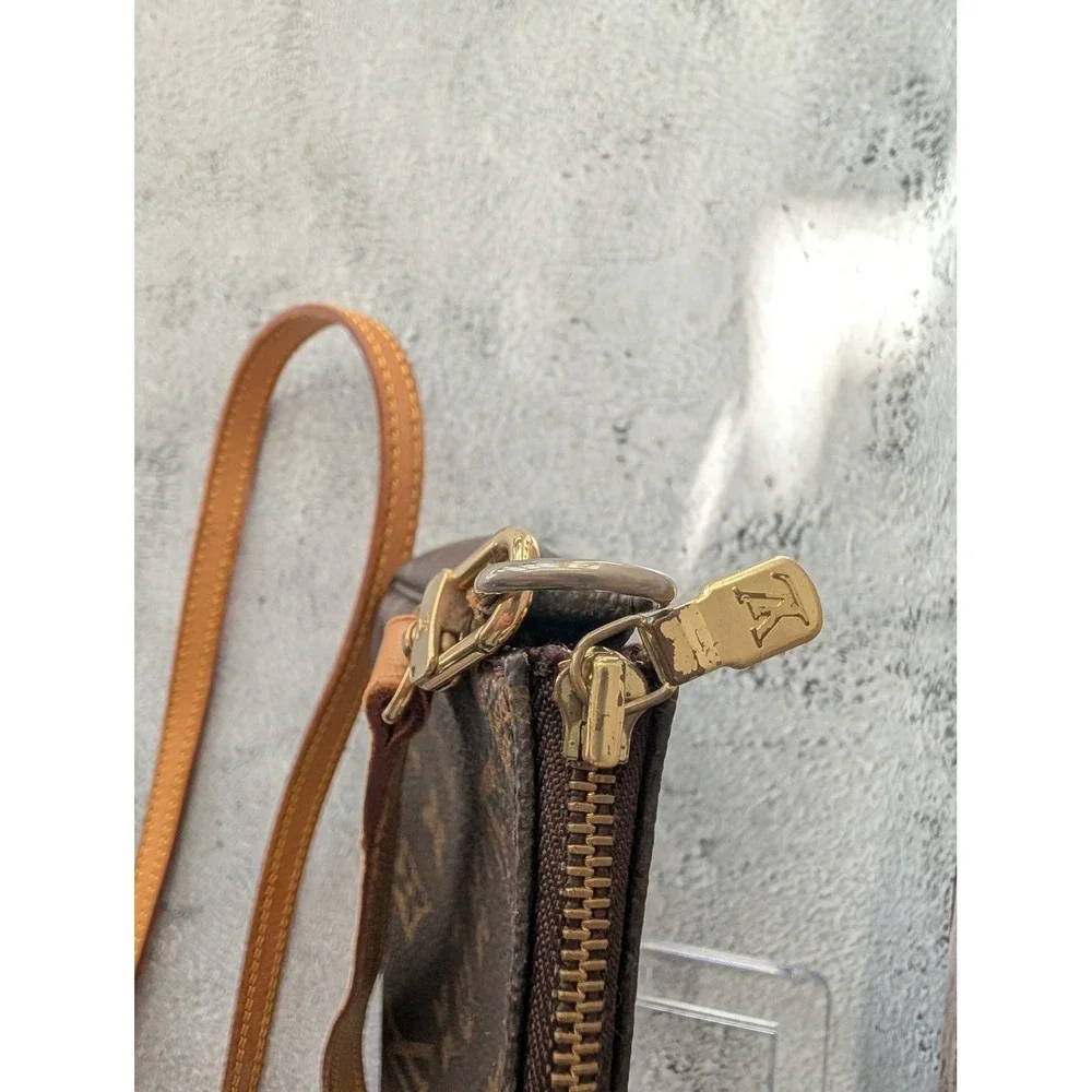 Pochette Accessories with COA crossbody strap and dust bag.